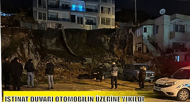 İSTİNAT DUVARI OTOMOBİLİN ÜZERİNE YIKILDI