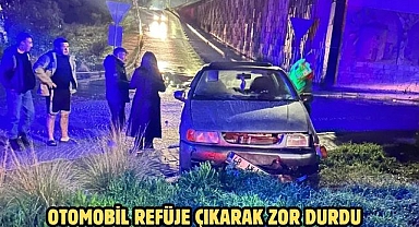 OTOMOBİL REFÜJE ÇIKARAK ZOR DURDU